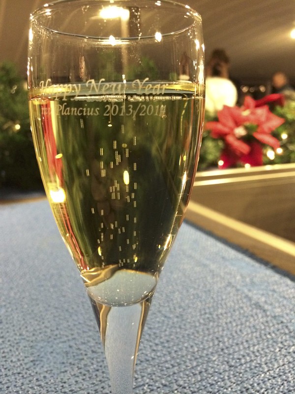 Champagne Glass saying "Happy New Year Plancius 2013/4"