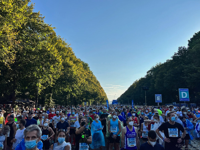 Starting blocks filled with runners wearing masks